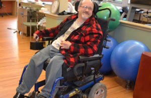 A Beechwood client smiles as we prepares for physical therapy.